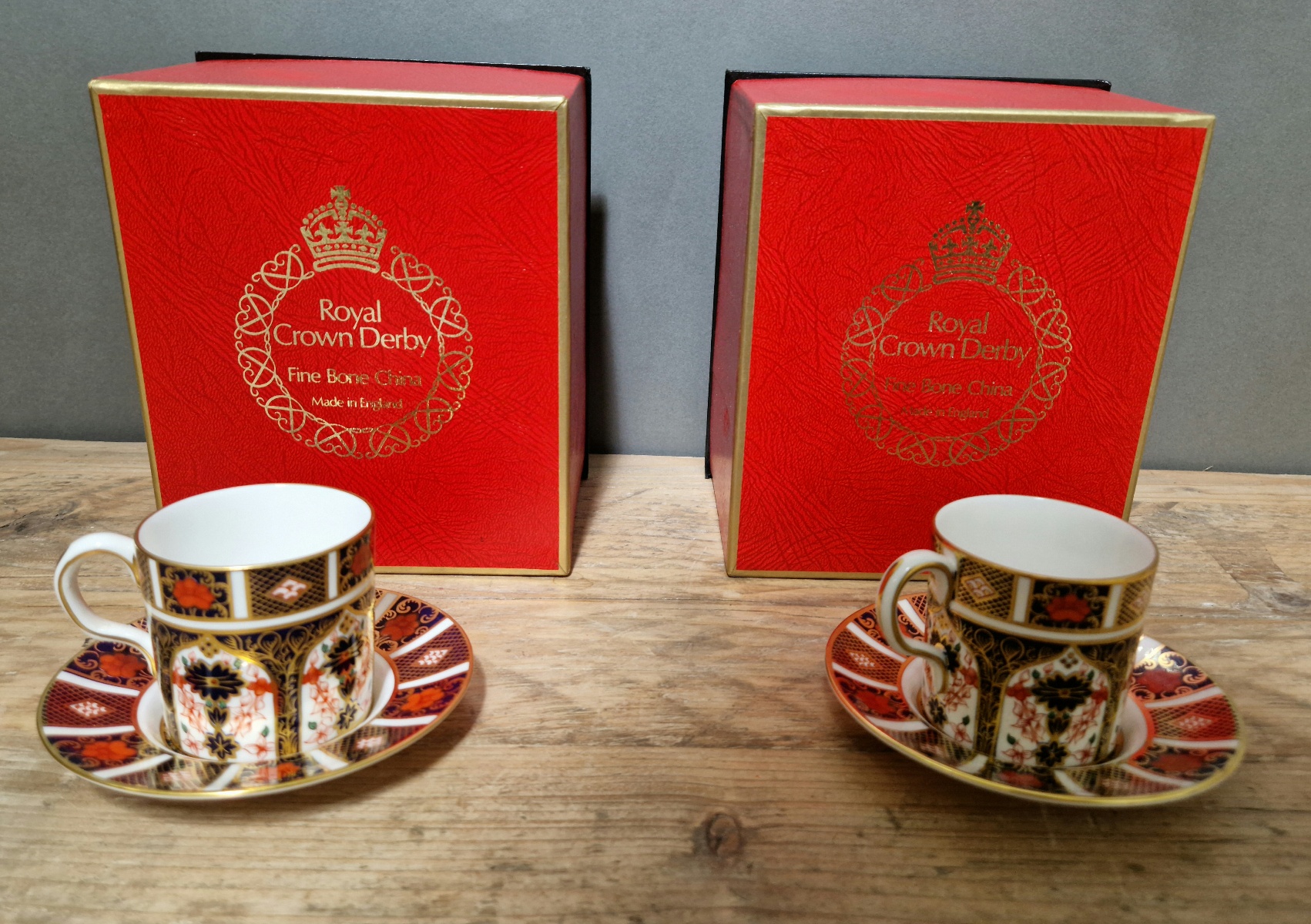 A set of two Royal Crown Derby 1128 Imari coffee cups and saucers, with boxes.