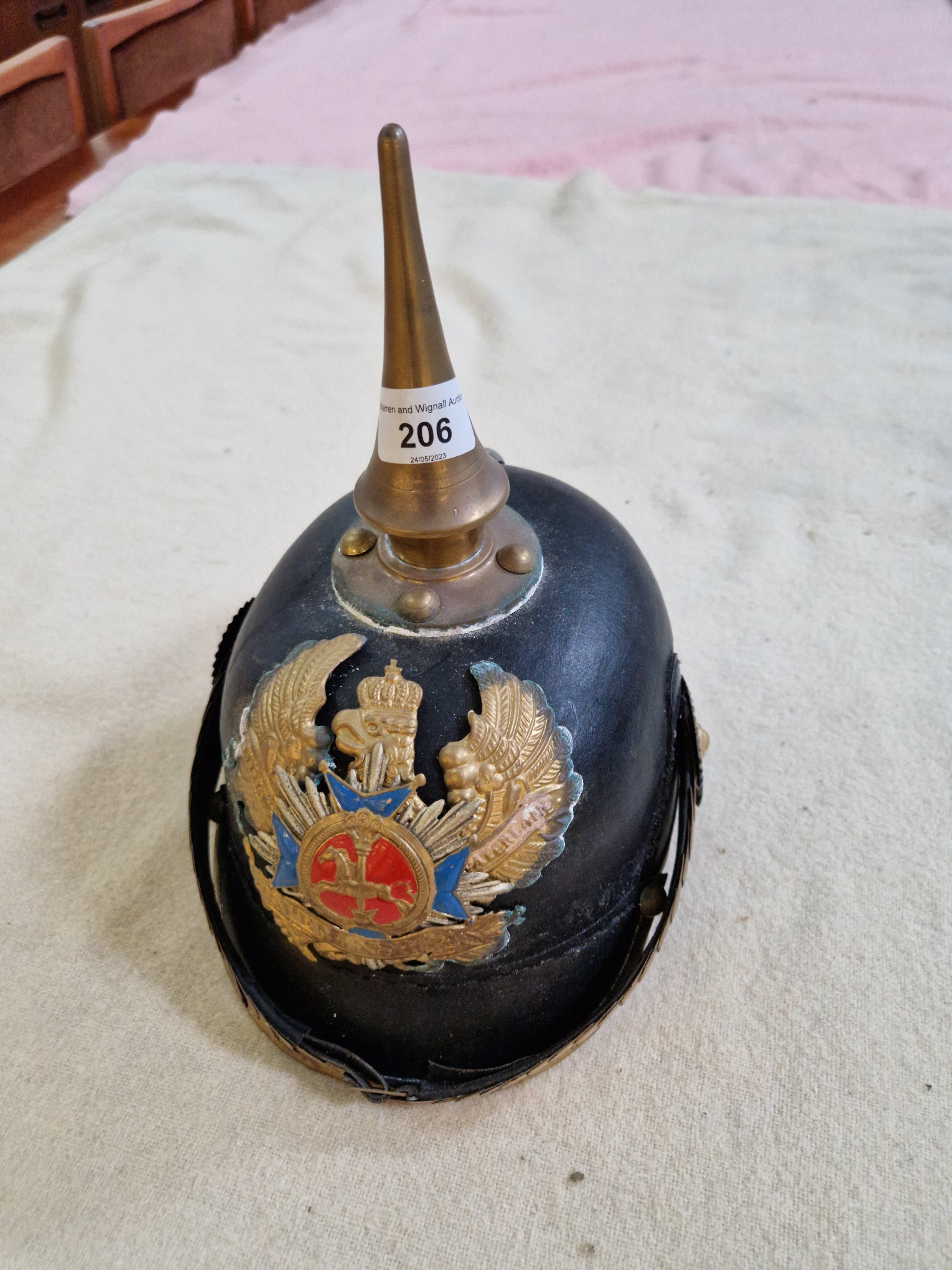 A group of four military helmets to include two Manchester Regiment Officer's blue cloth helmets, - Image 6 of 13