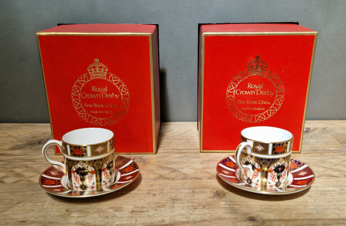 A set of two Royal Crown Derby 1128 Imari coffee cups and saucers, with boxes.