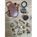 A collection of military / police buttons, badges and a WW2 marching compass in case.