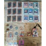 Binder of Yu-Gi-Oh cards with vintage Yu-Gi-Oh pin badges, tin, tazis, etc. sold as seen no returns.