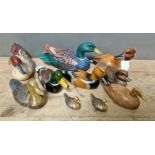 A collection of hand painted carved wooden & brass ducks