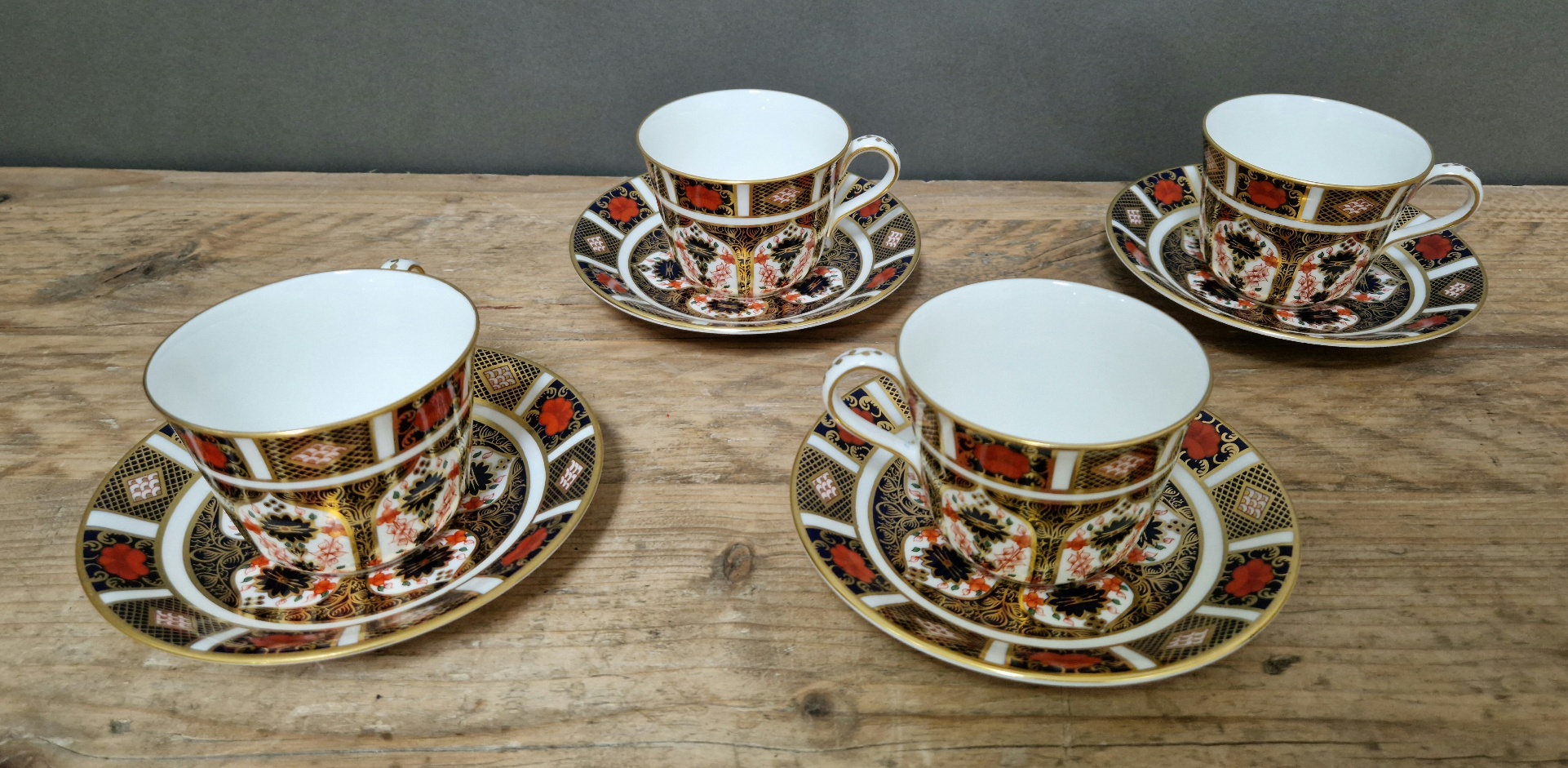 A set of four Royal Crown Derby 1128 Imari teacups and saucers.