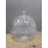 A large modelled glass cake stand and cover, height 32cm.