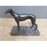 A spelter figure of a dog on marble base, length 19cm. Condition - large chip to base.