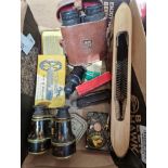 A box of collectables including two pairs of vintage binoculars, a vintage flying shuttle, darts,