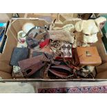 A box of miscellaneous collectable items including a Sylvac dog ornament, wooden souvenir knives,