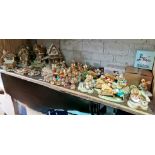 A collection of assorted PenDelfin figures & houses to include various event pieces, Wooden Hut,