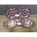 Six pieces of Royal Crown Derby 1128 Old Imari pattern china comprising three plates, a goblet and a