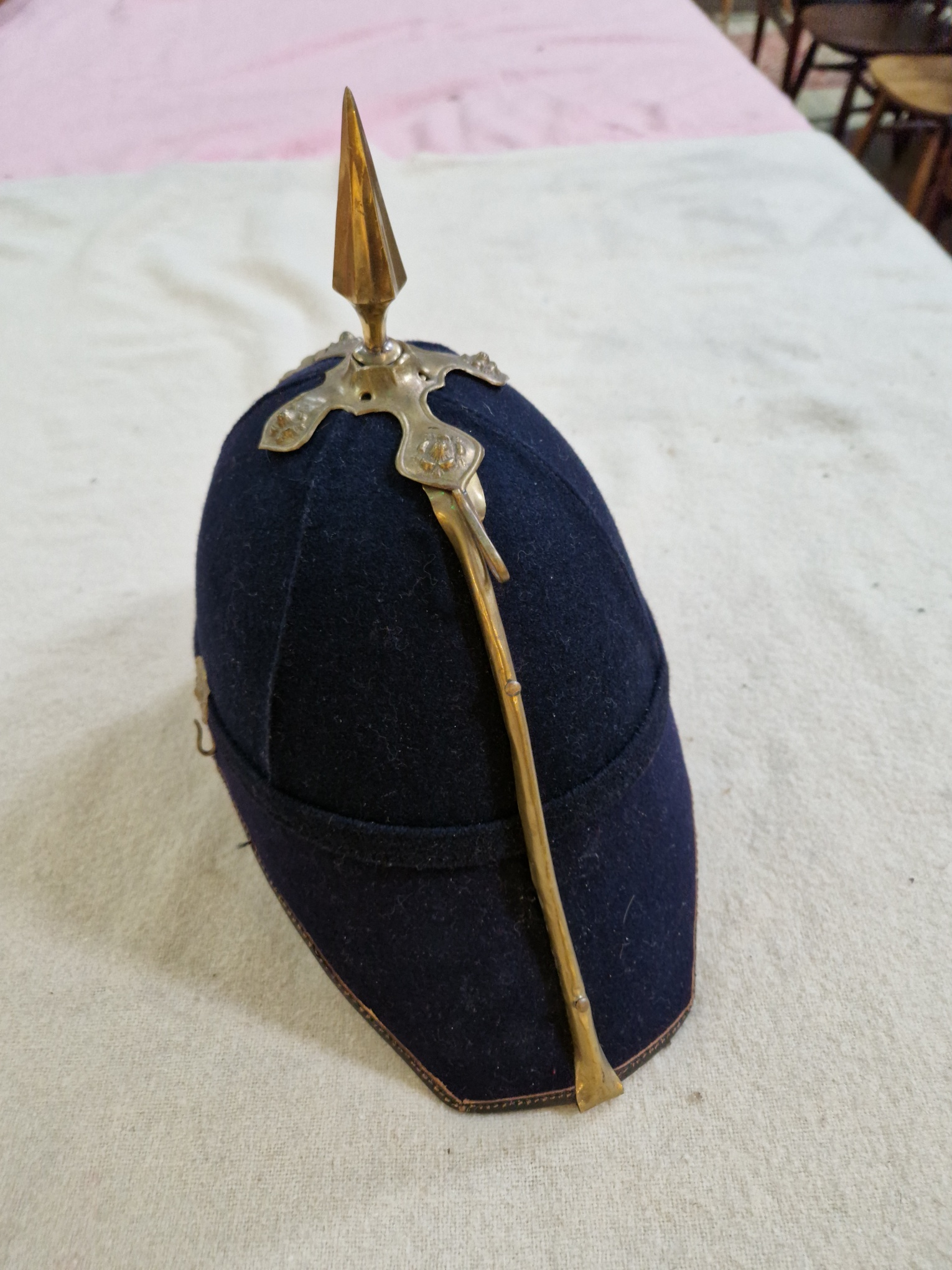 A group of four military helmets to include two Manchester Regiment Officer's blue cloth helmets, - Image 10 of 13