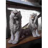 A pair of Italian glazed pottery lions, height 48cm.