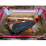 A box of assorted musical instruments to include a Hohner melodica, pan pipes, recorder & a duck