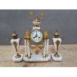 A French late 19th century gilt metal six pillar marble clock garniture, height 40cm.