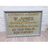 A painted wooden sign ESTIMATES ON REQUEST W. JONES BUILDING CONTRACTOR. WALL, FLOOR, TILING
