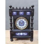 A late 19th century Aesthetic style architectural mantle clock, ebonised with blue and white pottery