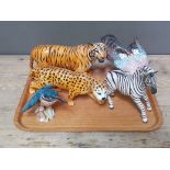 Five Beswick animals comprising a tiger, a leopard, a zebra, a kingfisher and another bird.