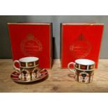 A set of two Royal Crown Derby 1128 Imari coffee cups and one saucer, with boxes.