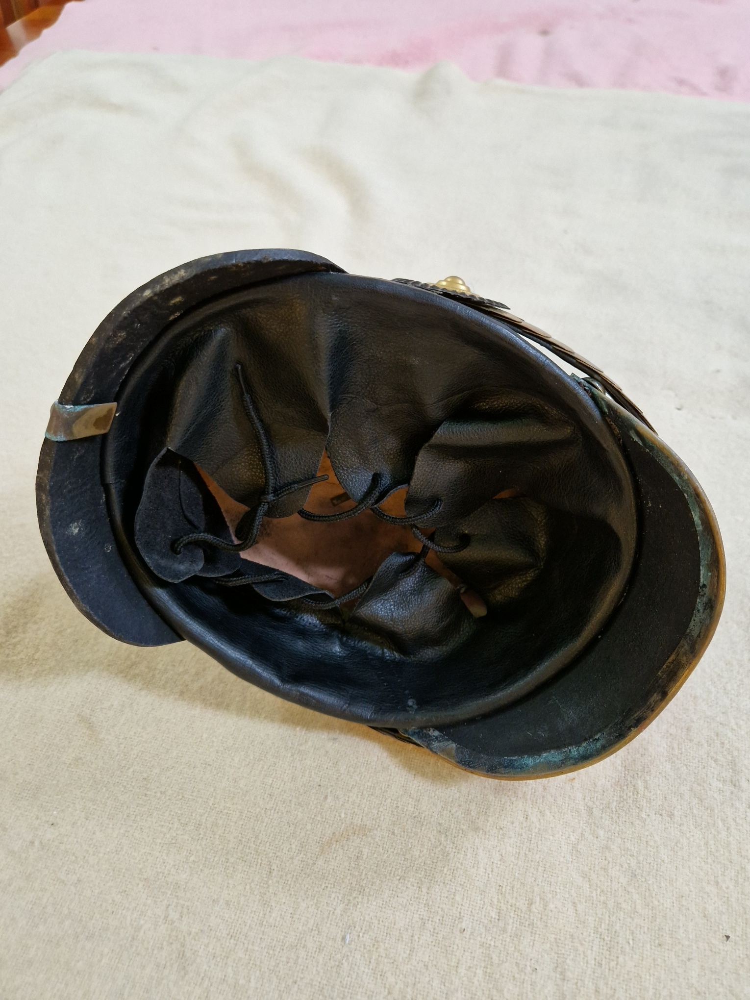 A group of four military helmets to include two Manchester Regiment Officer's blue cloth helmets, - Image 5 of 13