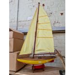 A large model pond yacht on stand, height approx. 130cm.