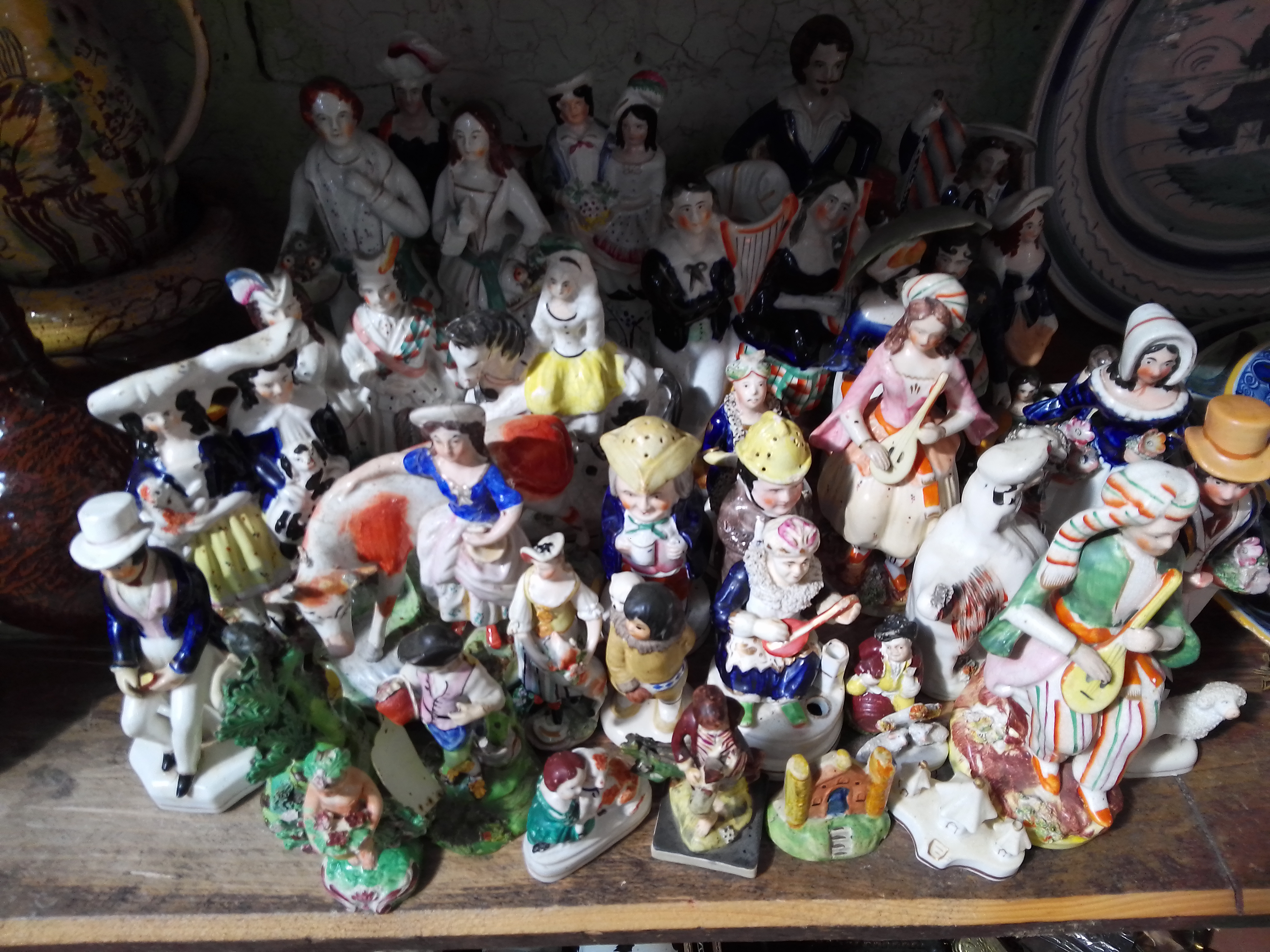 A collection of Staffordshire figures.