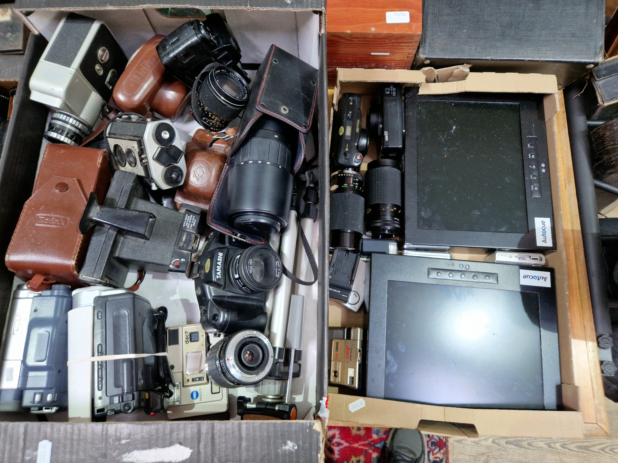 Two boxes of various cameras and accessories to include Kodak, Sigma, Halima, Tamashi, Minolta, etc.