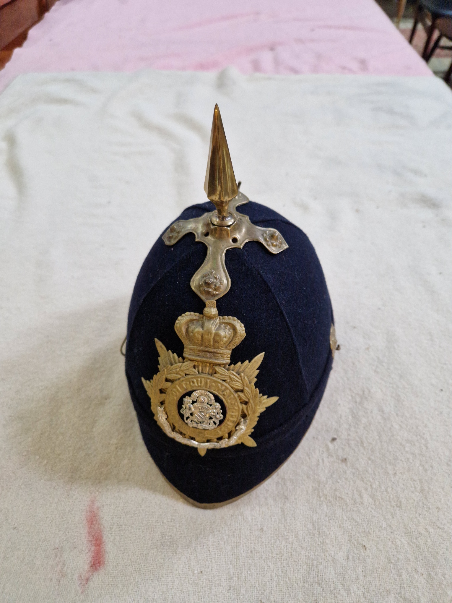 A group of four military helmets to include two Manchester Regiment Officer's blue cloth helmets, - Image 8 of 13