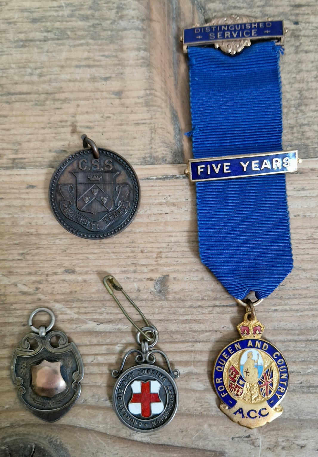 A collection of service and sports medals including two silver medals.