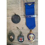 A collection of service and sports medals including two silver medals.