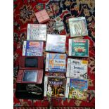 A Nintendo DS with charger, accessories and 9 boxed puzzle games.