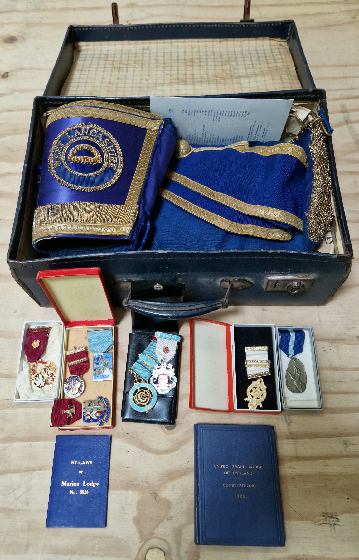 A case of Masonic regalia including three hallmarked silver medals.