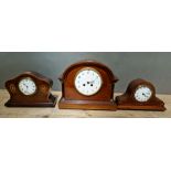 A group of three Edwardian mantle clocks.