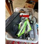 An Xbox 360 console with various games and accessories including Guitar Hero guitar, steering