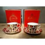 A set of two Royal Crown Derby 1128 Imari teacups and saucers, with boxes.