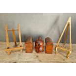 A group of treen to include 2 table easels, 2 small boxes and a lidded pot.