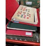 Two vintage world and Commonwealth stamp albums plus a folder of Commonwealth stamps