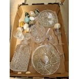 A box of assorted glassware and marble eggs.