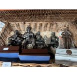 An F&M wicker basket containing various miltary figurines.
