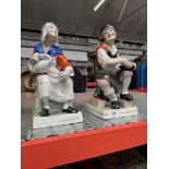 A pair of Staffordshire figures.