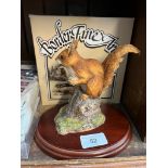A Border Fine Arts Red Squirrel figure on a wooden plinth, with original box