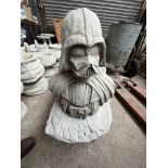 A Darth Vader garden ornament.