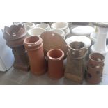 Four chimney pots, a terracotta strawberry planter and a stoneware fire pit/planter.