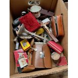 A mixed box including small clogs, crucifix, cutlery, gents grooming kit etc
