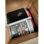 A box of assorted stamp albums, two vintage bottles and a book on Warrington history