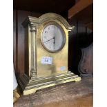 A French brass mantle clock.