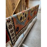 A Turkish Kilim style wool rug, orange ground.