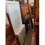 A vintage white painted kitchenette.