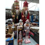 A group of six wooden nutcracker figures, tallest pair 80cm.