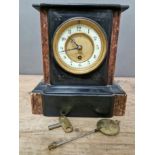 A black slate and marble mantle clock, with gilt and enamel face, pendulum and key.