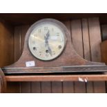 An oak mantle clock.