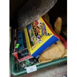 A box of toys including Arcade classic console and games, model cars, teddy bear etc